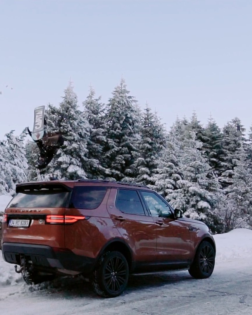 Land Rover Discovery in a snowy forest