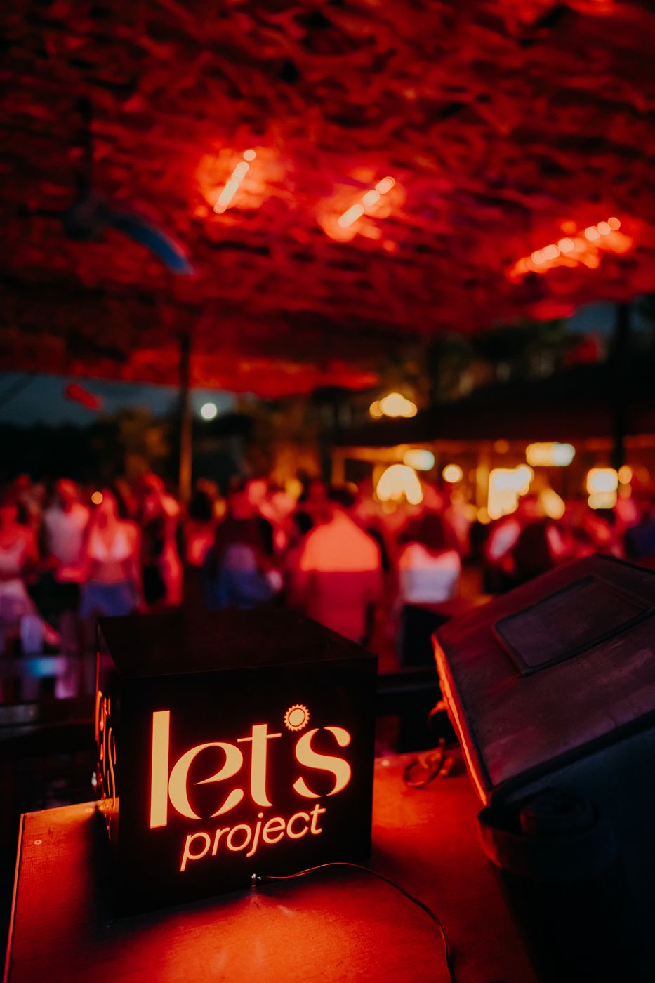 Let's Project — light-box logo on the DJ table