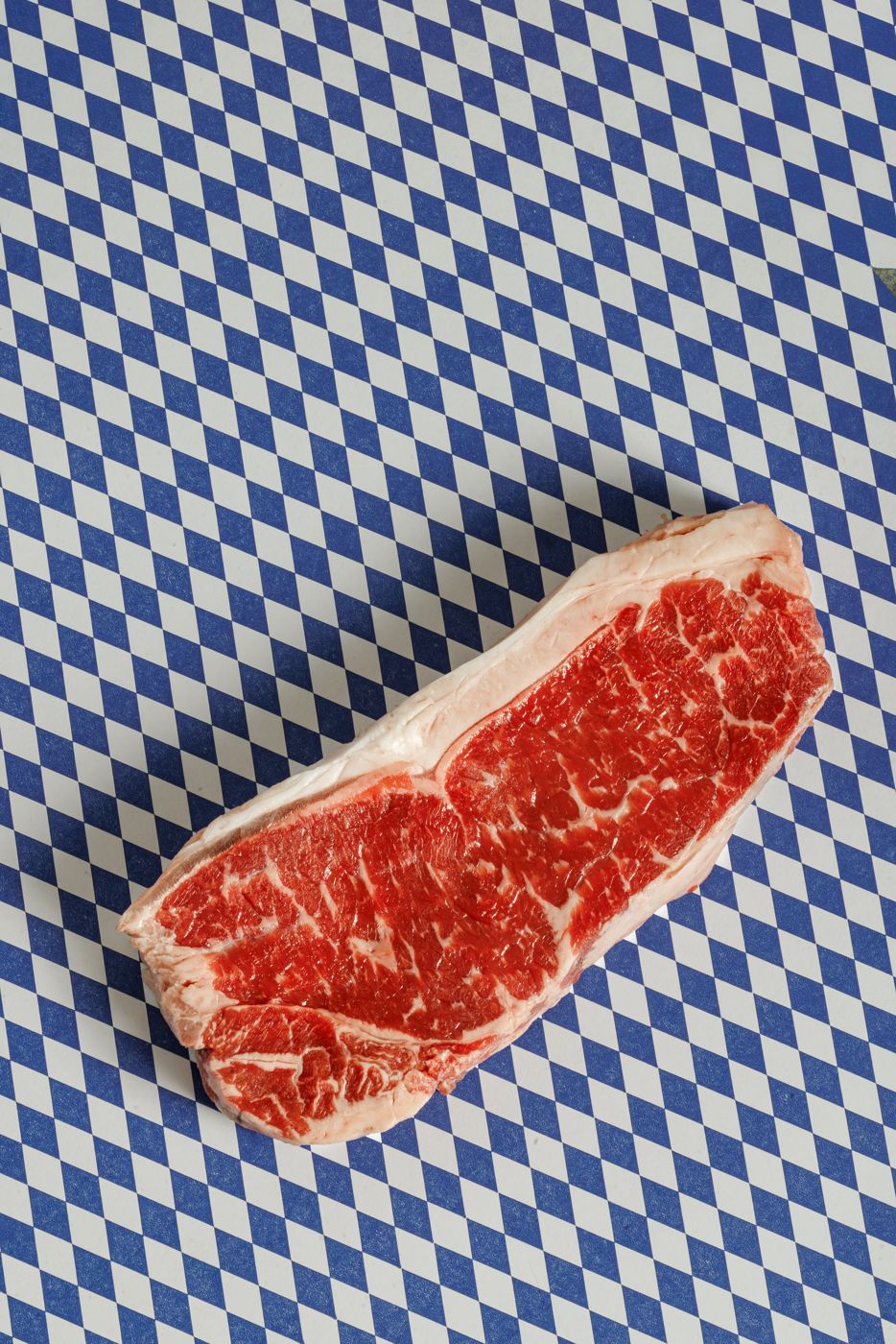 Ragyu — New York strip on blue butcher paper
