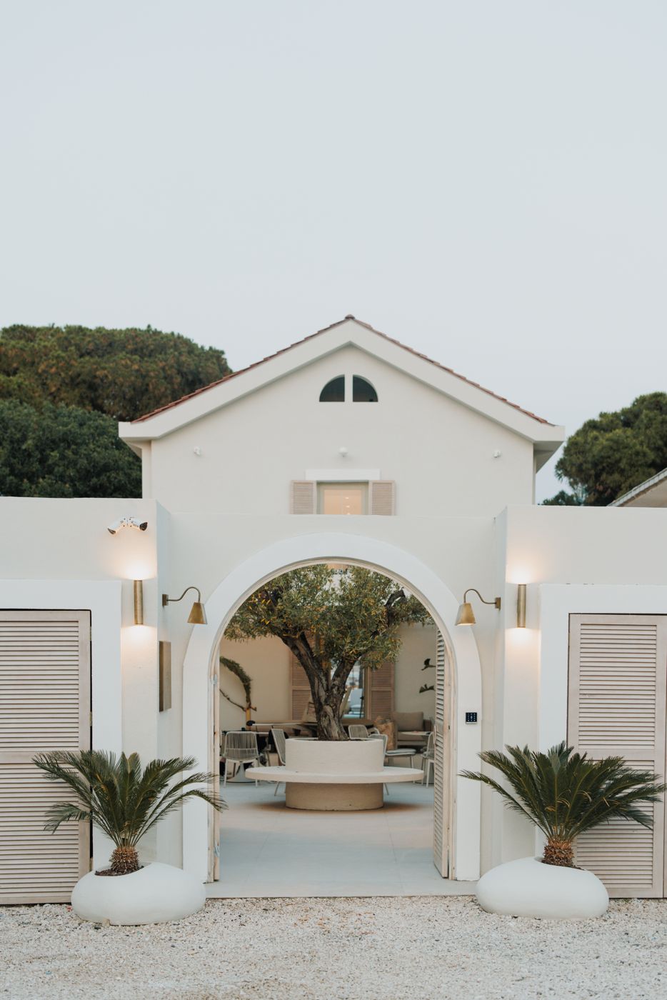 Vucino — arched white entrance and courtyard